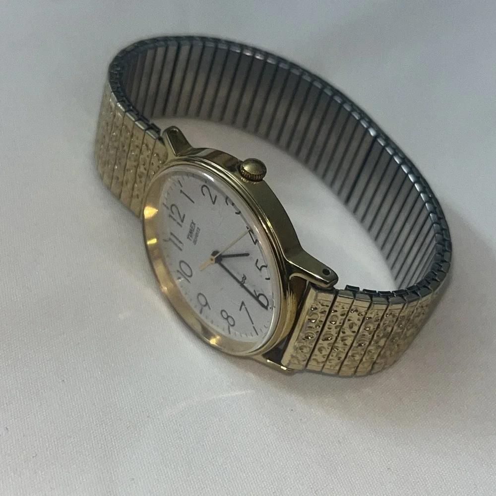 Vintage Gold Band Timex Watch. LA CELL. White Face. Metal Band. Needs Battery‎